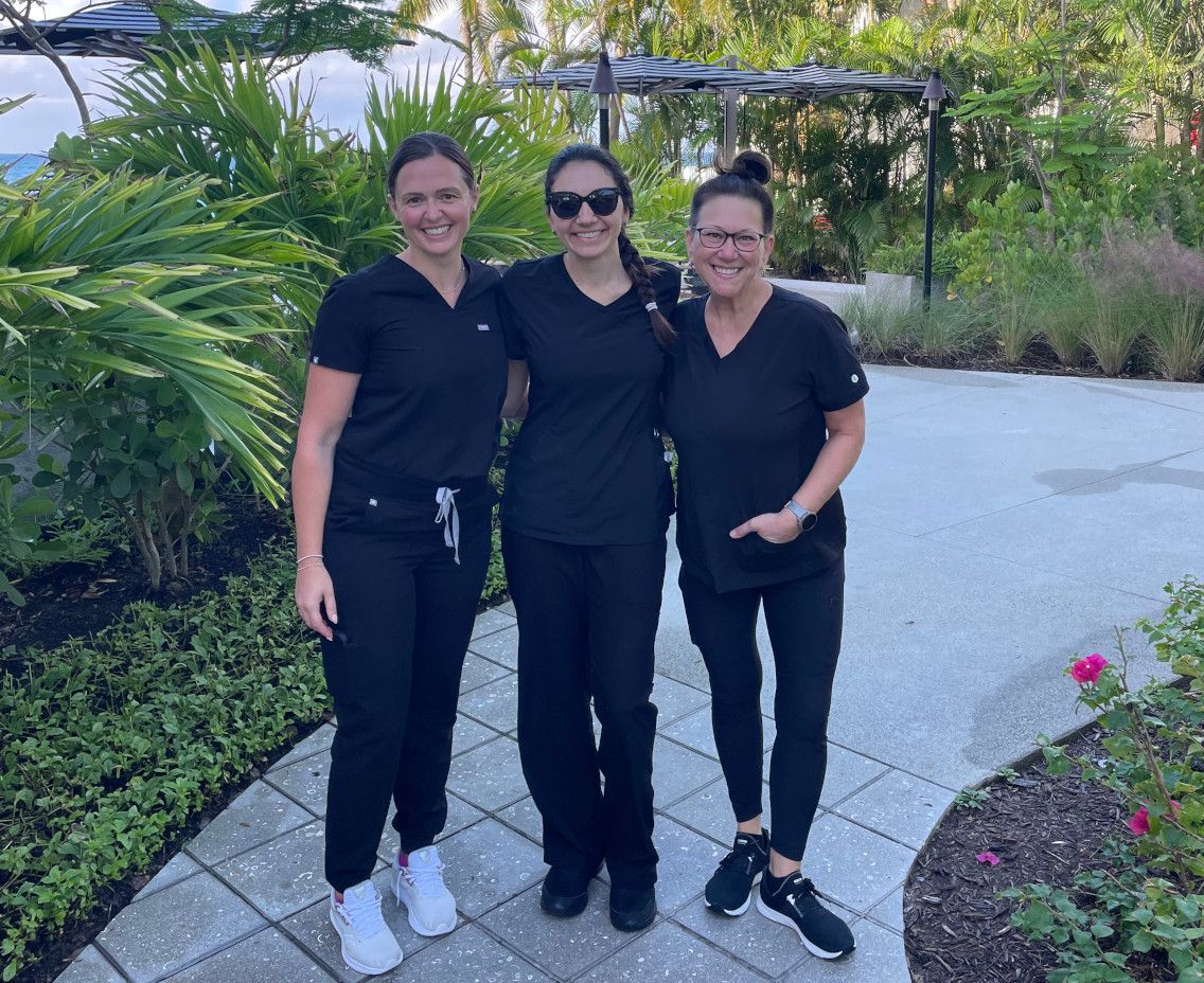 A picture of Dr. Clark with a pair of coworkers