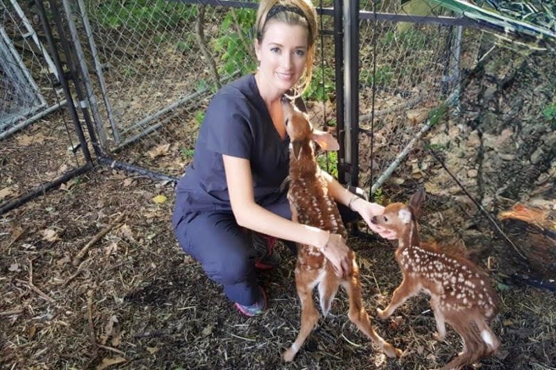 A picture of Dr. James with two deer