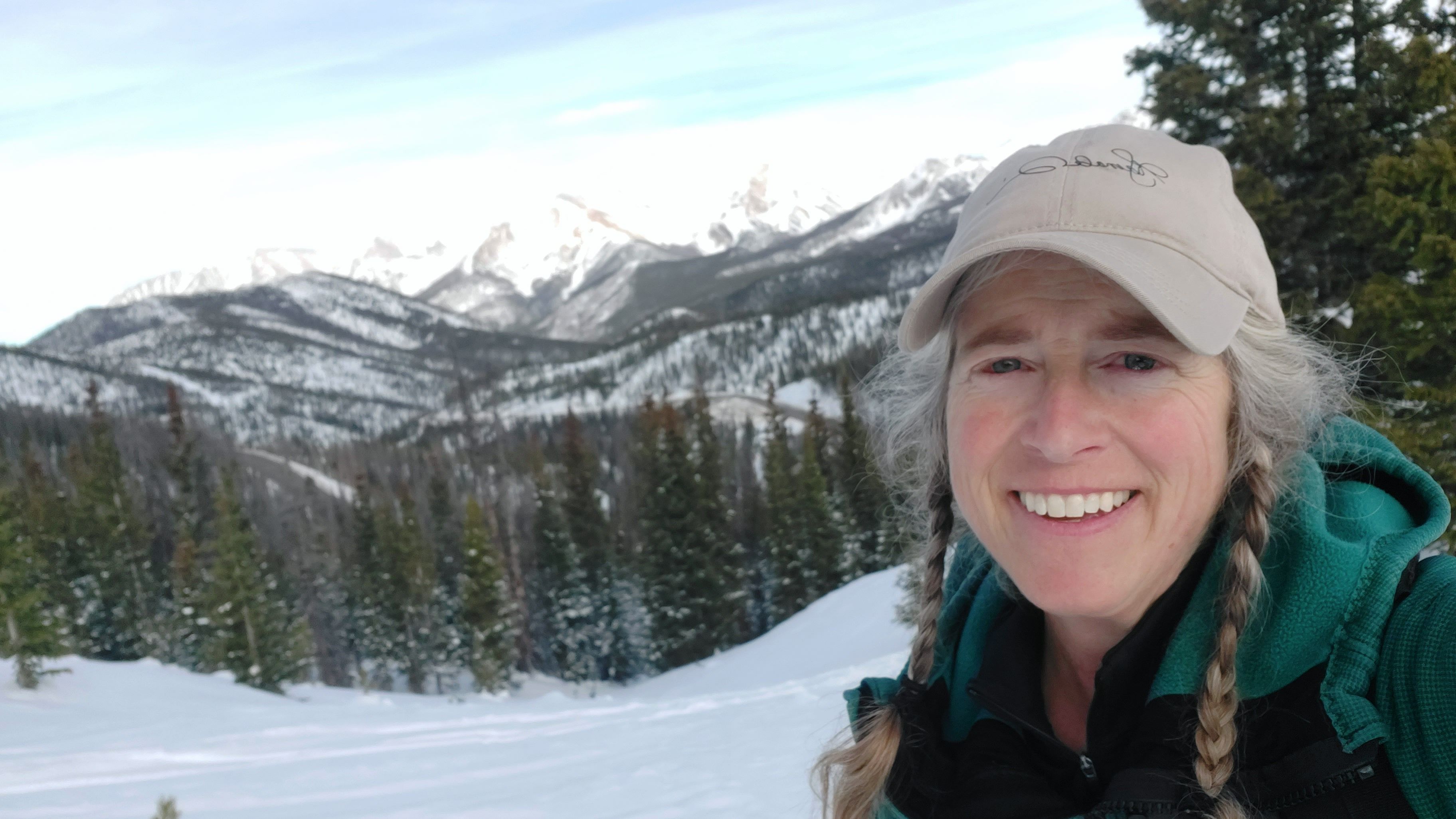 A picture of Jo Myers against a mountainous backdrop