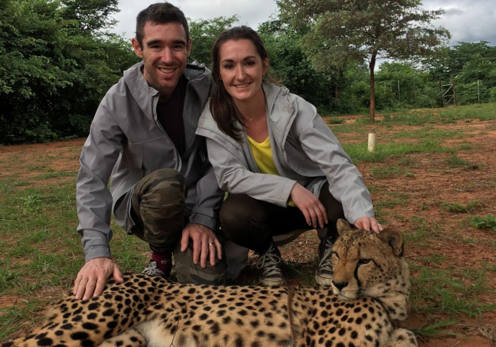 A picture of Dr. Julian petting a cheetah