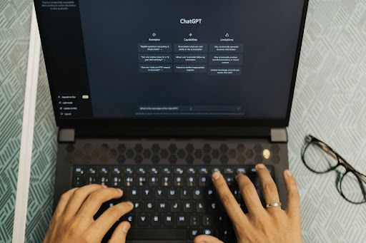 A laptop open to a ChatGPT interface